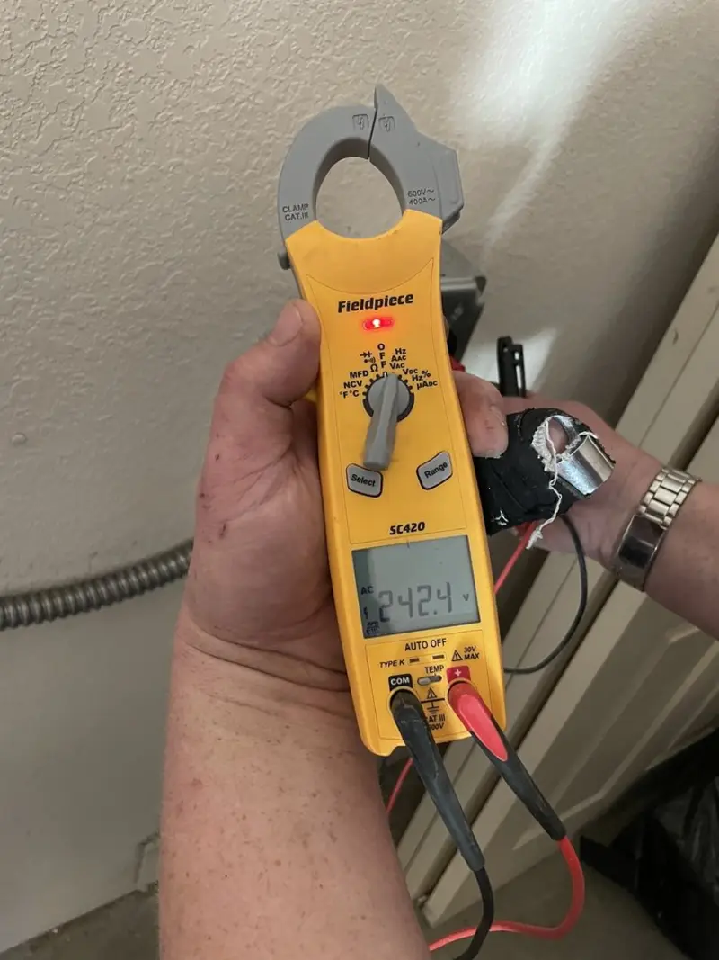 Voltage testing with clamp meter during Ceiling Fan Installation in Park City